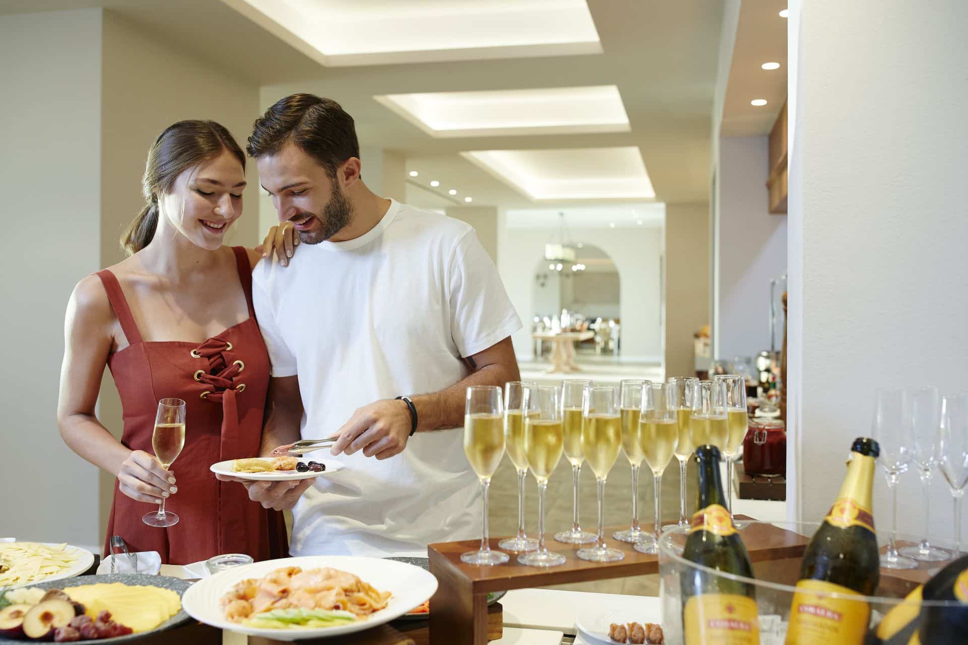 Couple enjoying a buffet at a romantic honeymoon hotel in Corfu